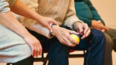 woman comforting elderly patient